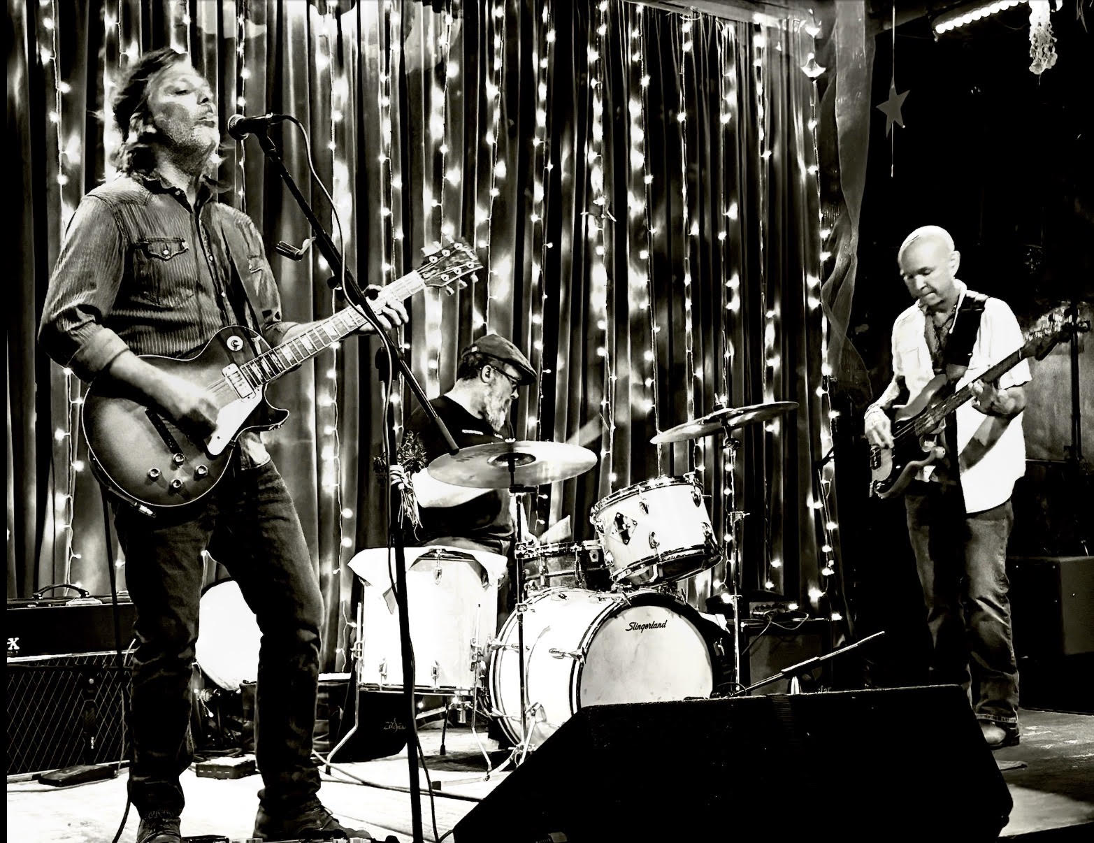 Revelwood Mission performing live with guitar, drums and bass